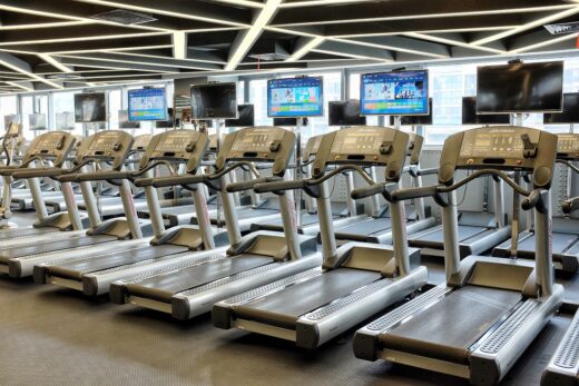row of treadmills at gym