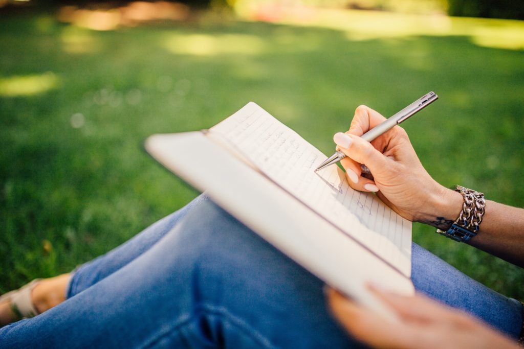 Writing outside in the grass